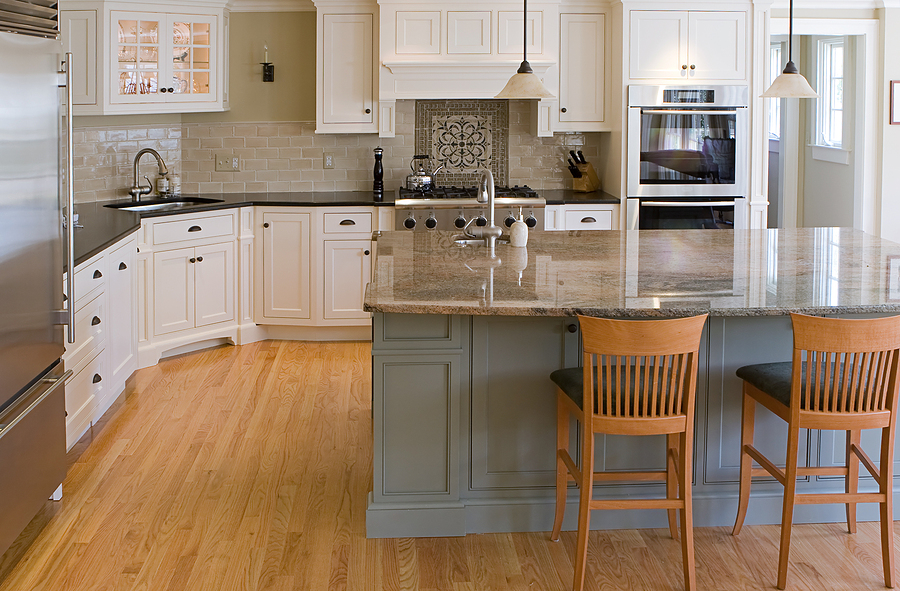 Photo of a modern kitchen with custom white cabinetry. 